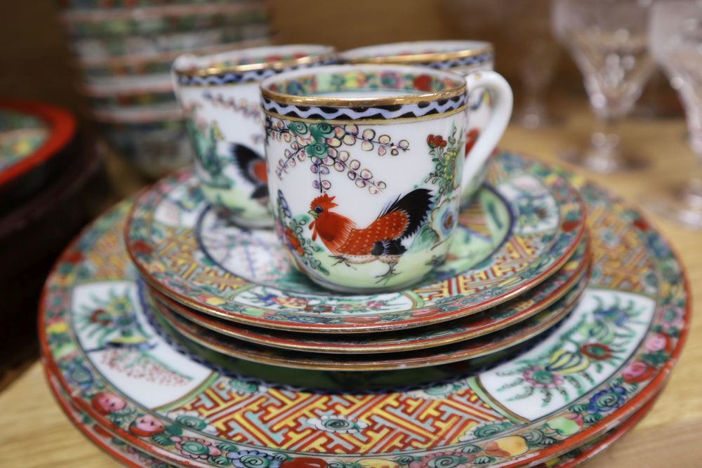 A collection of early 20th century Cantonese porcelain tea and dinnerwares, including an hors doeuvres set, in a lacquer box